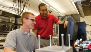 Nikhilish Chawla (standing) with doctoral student James Mertens. Photo credit Jessica Slater/ASU.