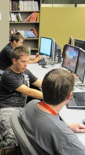 SoDA_Cropped The Software Developer’s Association student club enables ASU students (from top) students Joe Cowen-Richards, David Kahn and Patrick Traynor to work with some of the latest computer software programs. Photo: Travis Sein/ASU