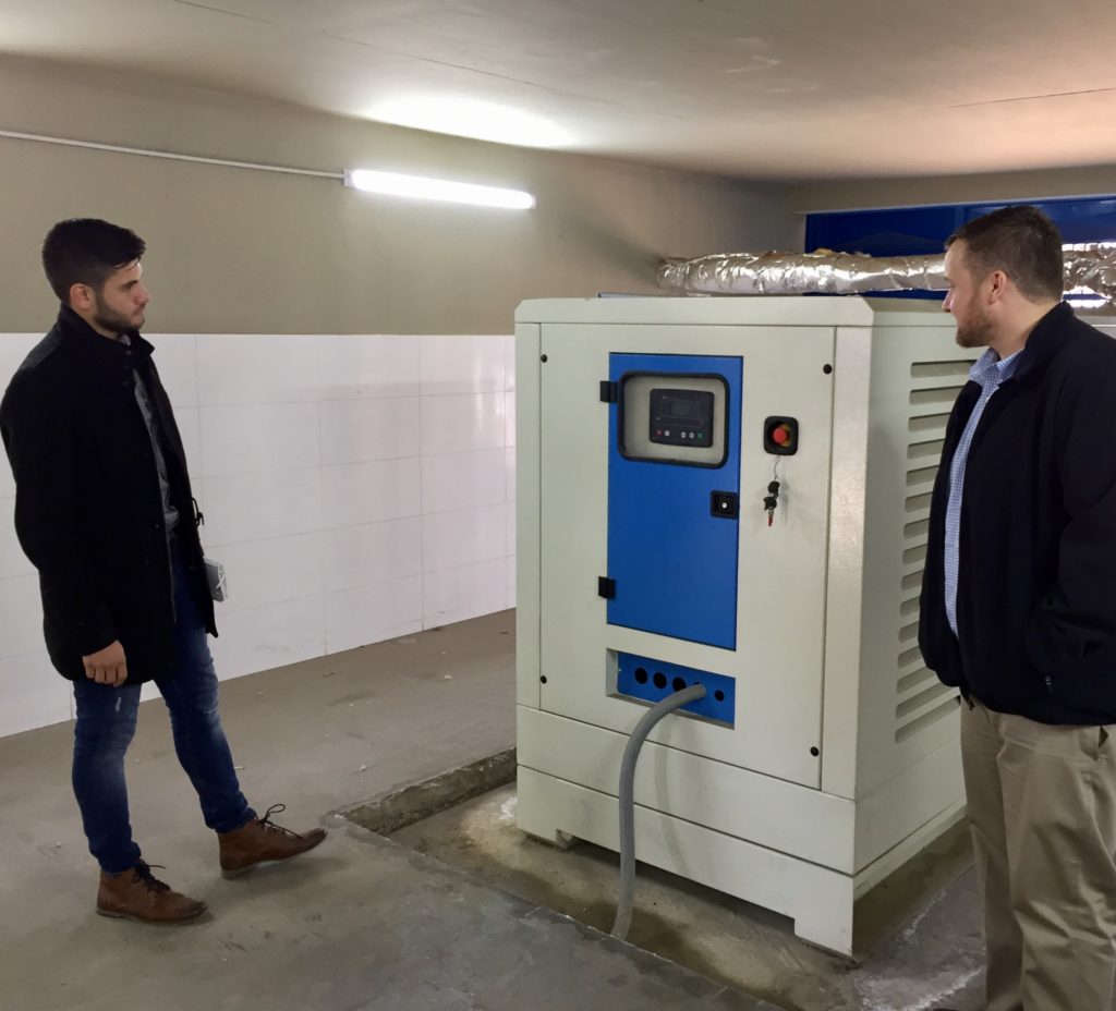 Hasan Daouk of Zero Mass Water and ASU Professor Rhett Larson discuss placement of H2O for Humanity’s AquaSafi-2000 water purification system in the existing kiosk at an out-of-use well in Qubbe, Lebanon. Photo courtesy of Ashley St. Thomas/ASU Walton Sustainability Solutions Initiatives