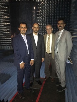 Portrait of four men with a caption of "KACST Chief Engineer Waleed Abduaziz Alomar, KACST Project Manager Turki A. Alanazi, ASU Principal Investigator Constantine A. Balanis and KACST Principal Investigator Hussein Nasser Shaman tour the ASU EMAC experimental facility during their February visit. Photo courtesy of Constantine Balanis."