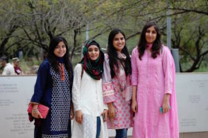 Photo of four girls standing in a row with a caption of USPCAS-E Scholars, Left to right: Farah Akram, Anam Zahra, Maham Akhlaq, Atoofa Zainab, Photographer: Erika Gronek/ASU