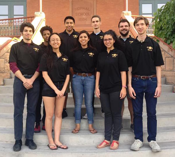 Photo of a group of students standing on the steps of Old Main with a caption of "The Next Level Devils on the steps of Old Main. Back row (L-R) Garrett Nez, Evren Uner. Middle row (L-R) Gashaw Bizana, Brittany Nez, Christian Sclafani. Front row (L-R) Alessandro Laspina, Justine Tang, Maria Samir and Patrick Hull. Not pictured Alek Cook, Robert Mann and Wakhile Shongwe. Photo courtesy of Next Level Devils"