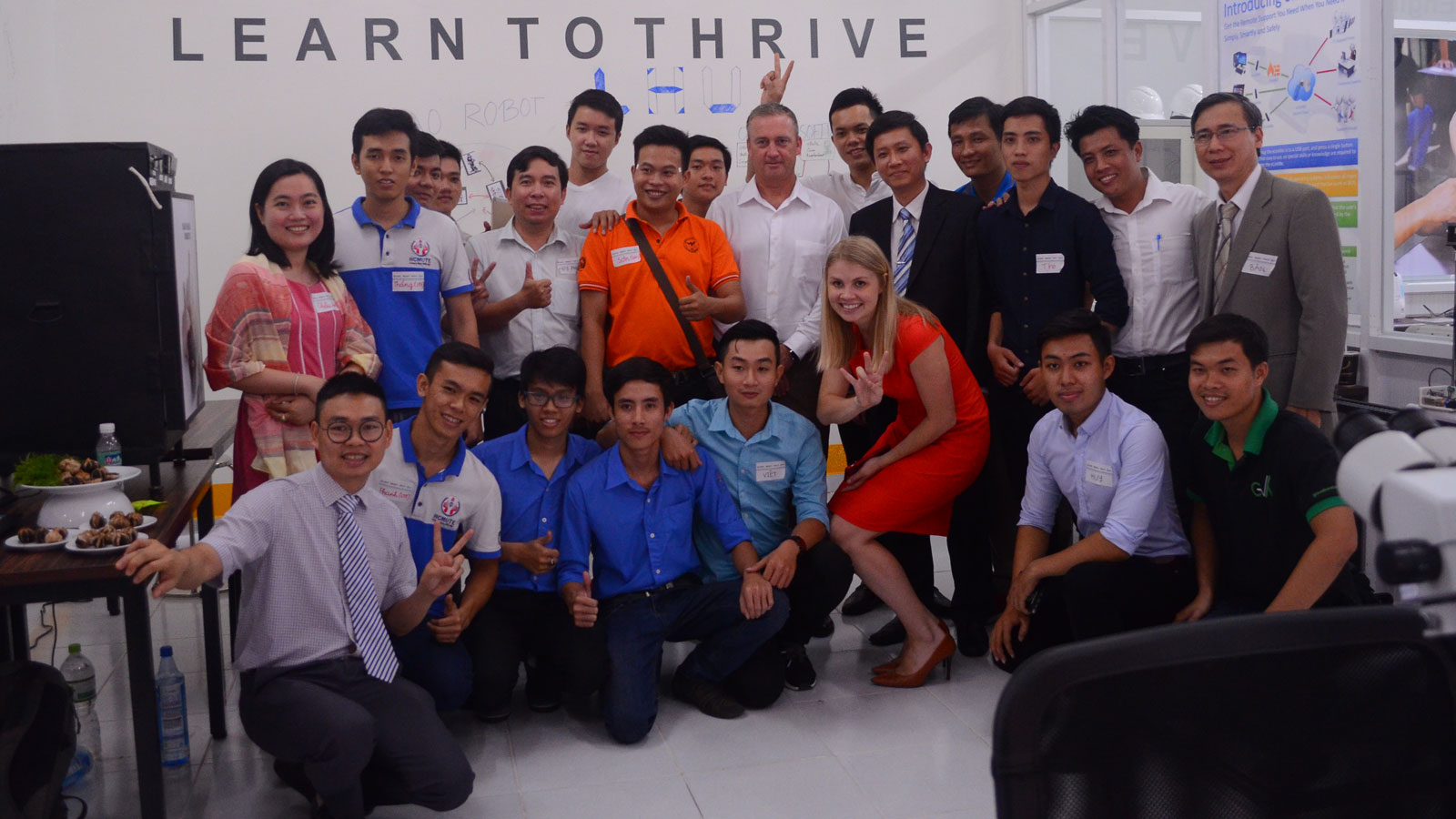 Photo of large group of people posing with a caption of "Arizona State University helped launch the Maker Innovation Space in Ho Chi Minh City, Vietnam, as part of the Building University-Industry Learning and Develop through Innovation and Technology program known as BUILD-IT, which brings academia, industry and government together to invest in a dynamic ecosystem for STEM innovation in Vietnam. Photo courtesy of BUILD-IT"