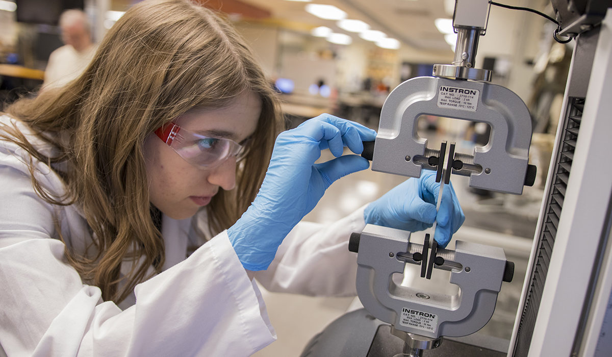 Photo of student working in lab. Caption: Chemical engineering sophomore Maeve Kennedy works in Associate Professor Vincent Pizziconi’s lab to study cell-based therapeutic devices for regenerative medicine. Kennedy conducted her research as part of the Grand Challenge Scholars Program, which tasks students to conduct research in one of the National Academy of Engineering’s 14 grand challenge themes, explore interdisciplinary coursework, gain a global perspective, engage in entrepreneurship and give back to the community through service learning. Photographer: Marco-Alexis Chaira/ASU