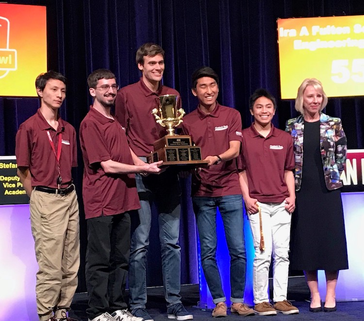 Photo of five students holding a trophy with Stefani Lindquist. Caption: The Fulton Schools Maroon team with ASU Deputy Provost and Vice President for Academic Affairs Stefani Lindquist. Photographer: Cortney Loui/ASU