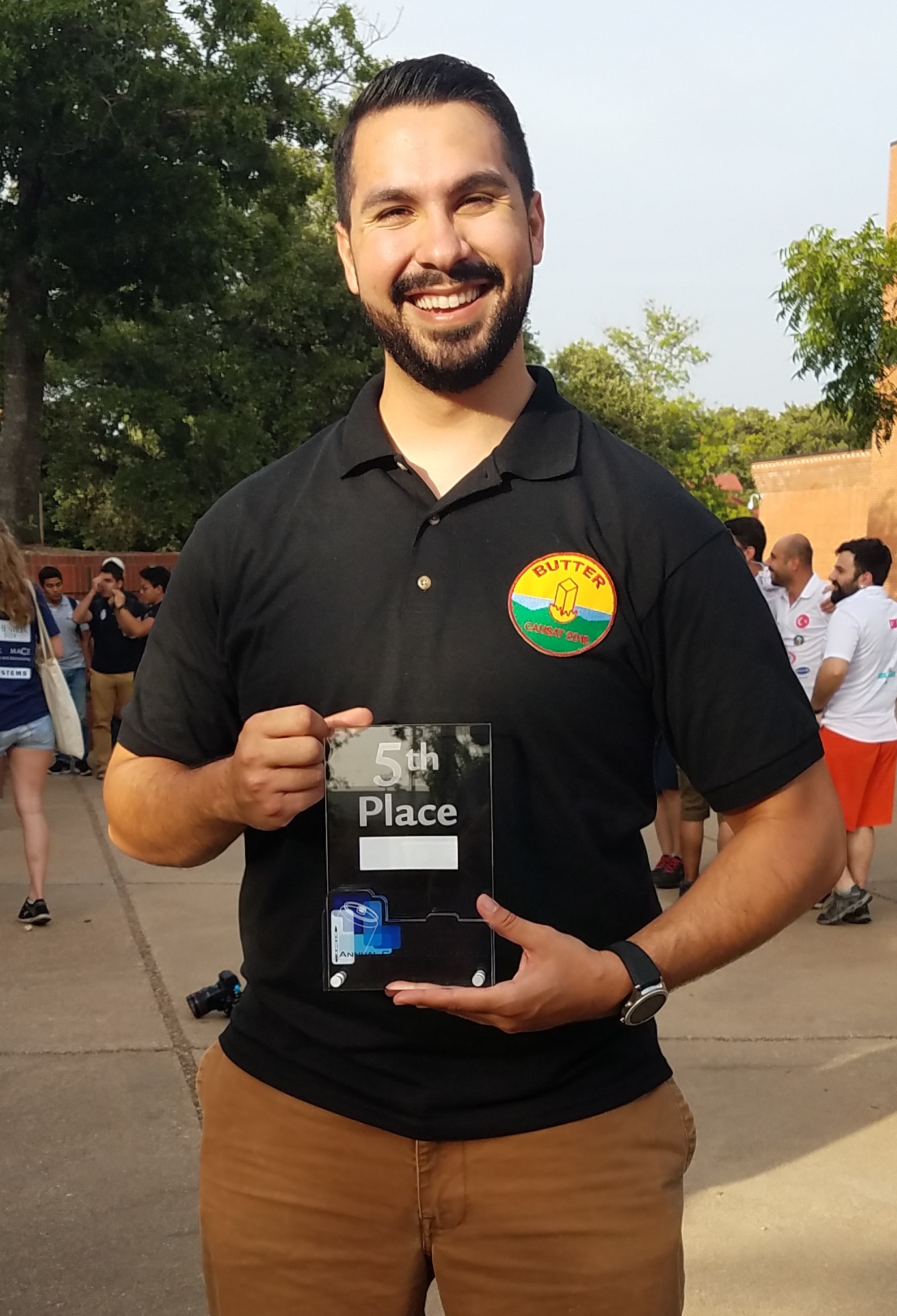 student holding a trophy