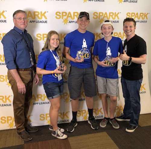 students holding awards