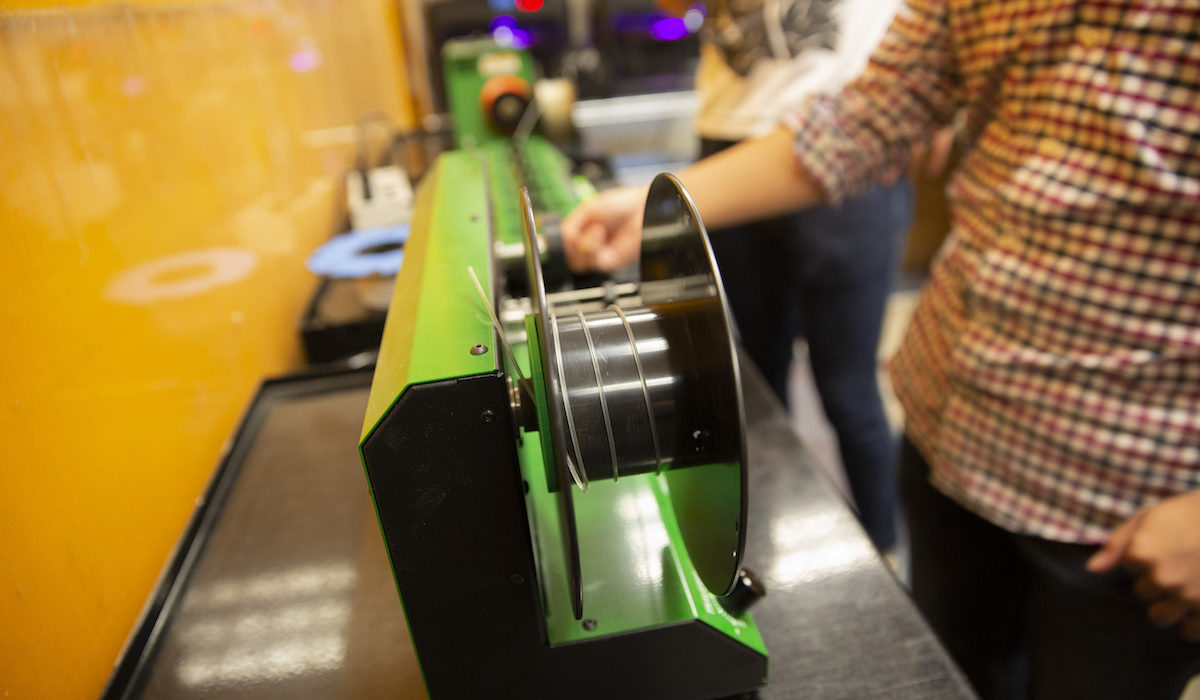 The finished recycled plastic is wound onto a spool.