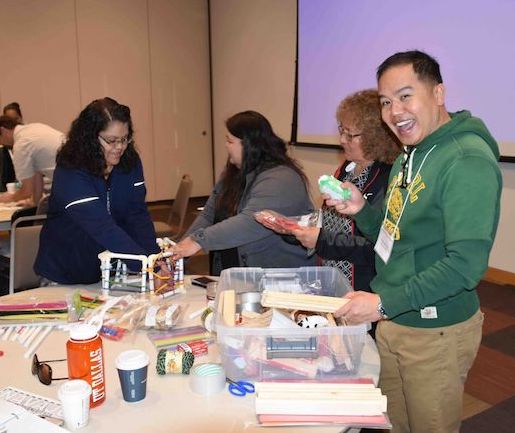 teachers standing at a table