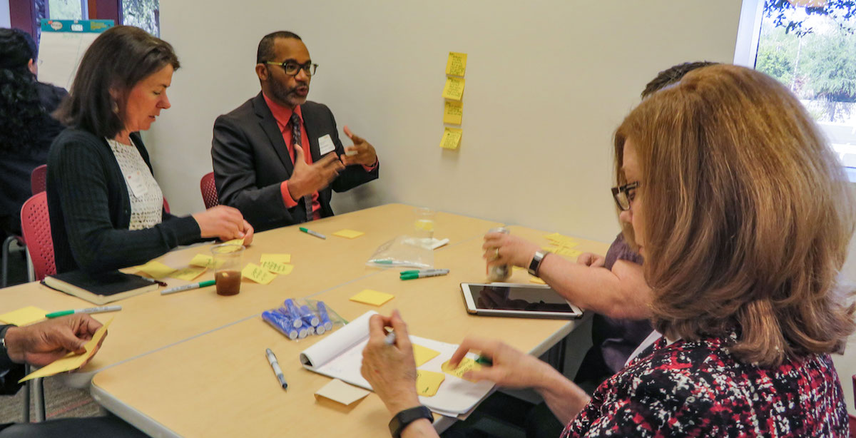 people sitting at a table talking