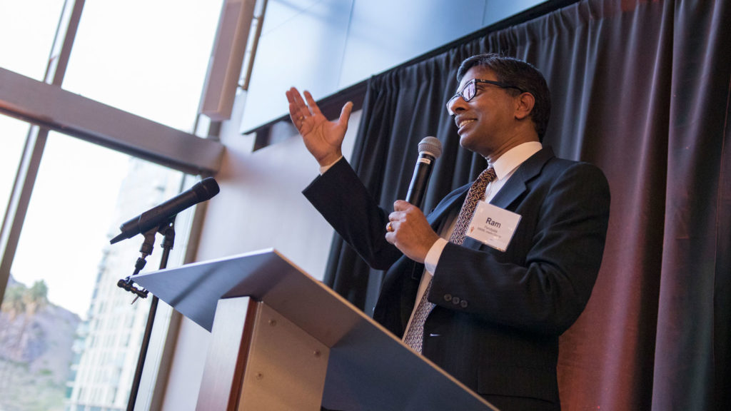 Ram Pendyala speaks at a microphone.