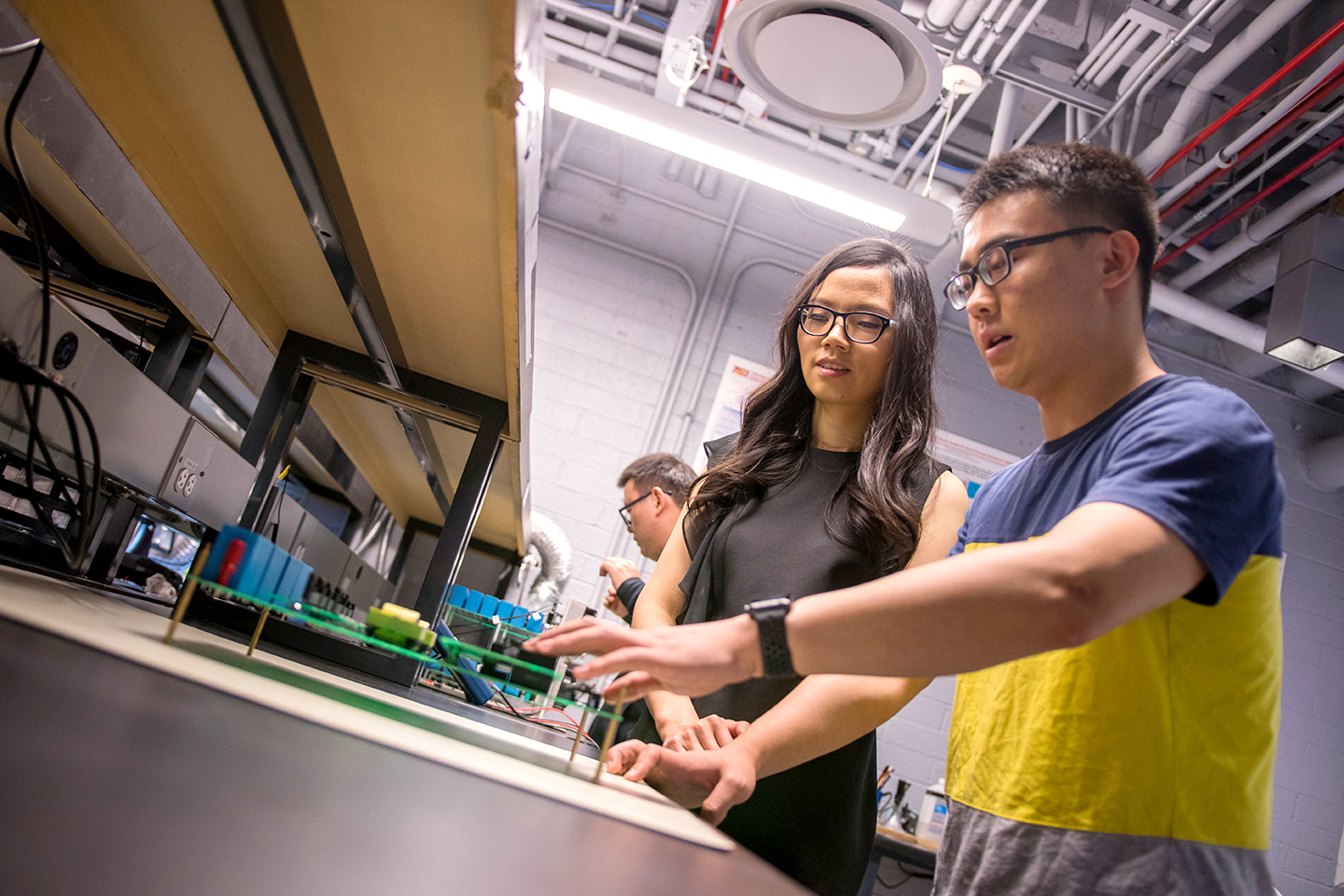 student and professor in a lab