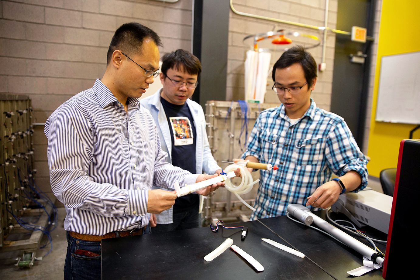 professor and two students in lab
