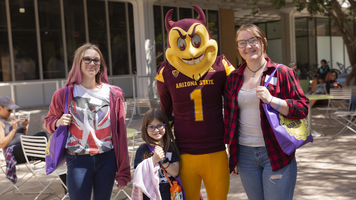 girl scouts standing with Sparky the Sun Devil