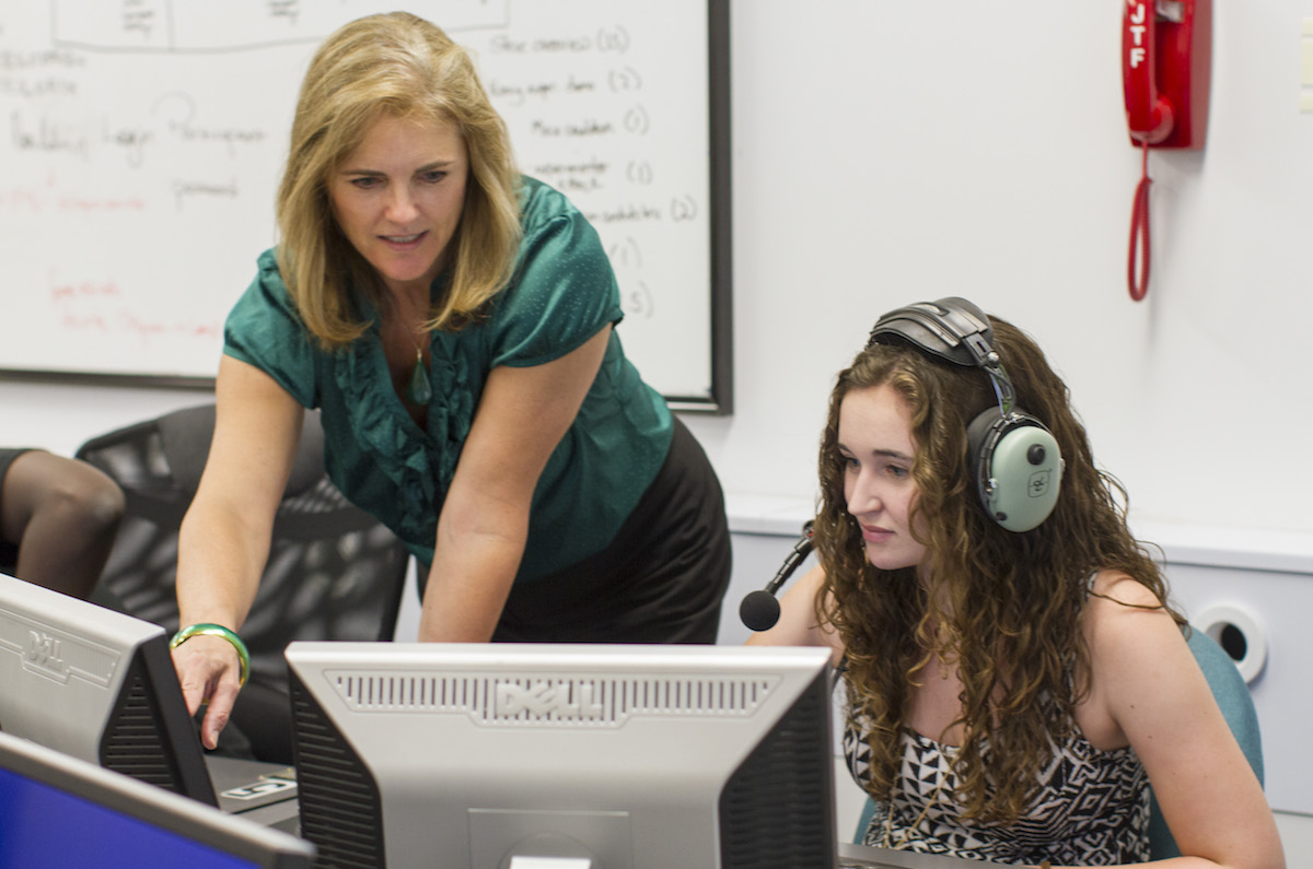 Professor working with student in a lab