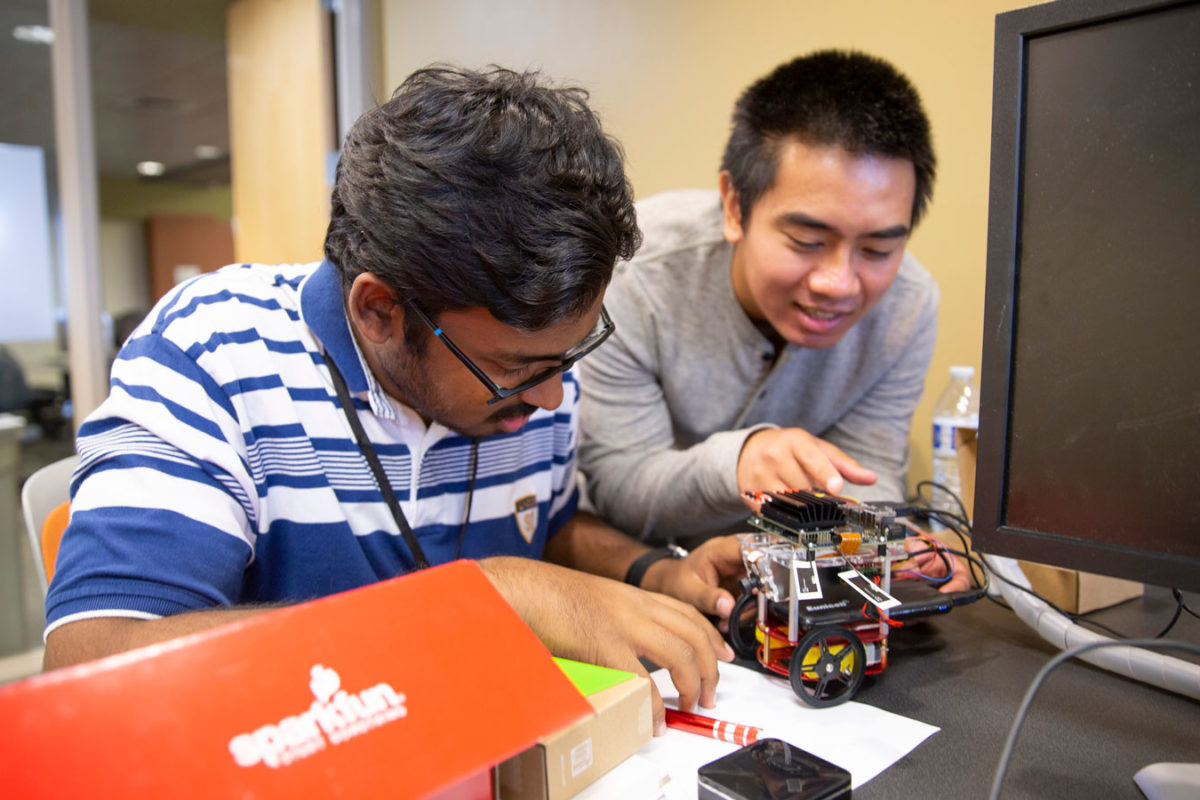 students working on robot