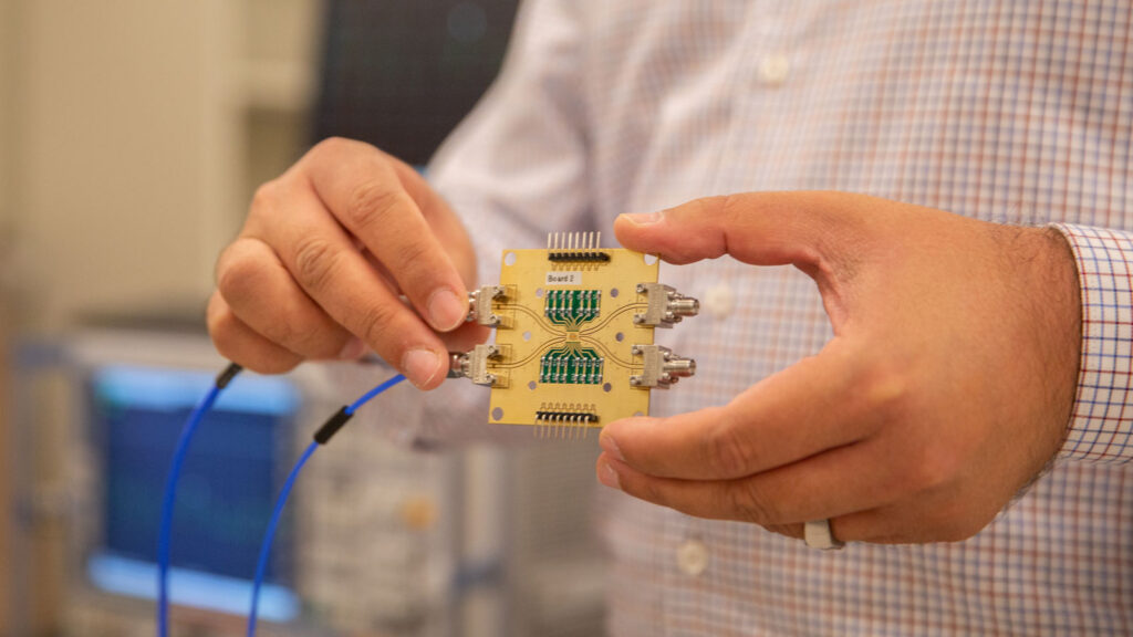 Saeed Zeinolabedinzadeh holds an integrated circuit.