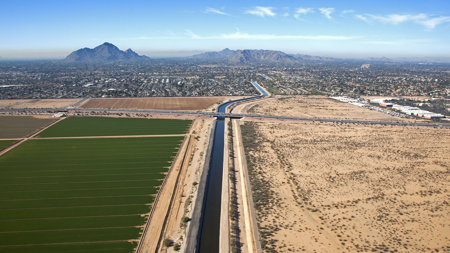 shutterstock_125882198w An irrigation canal running near agricultural fields in the Phoenix metropolitan area.