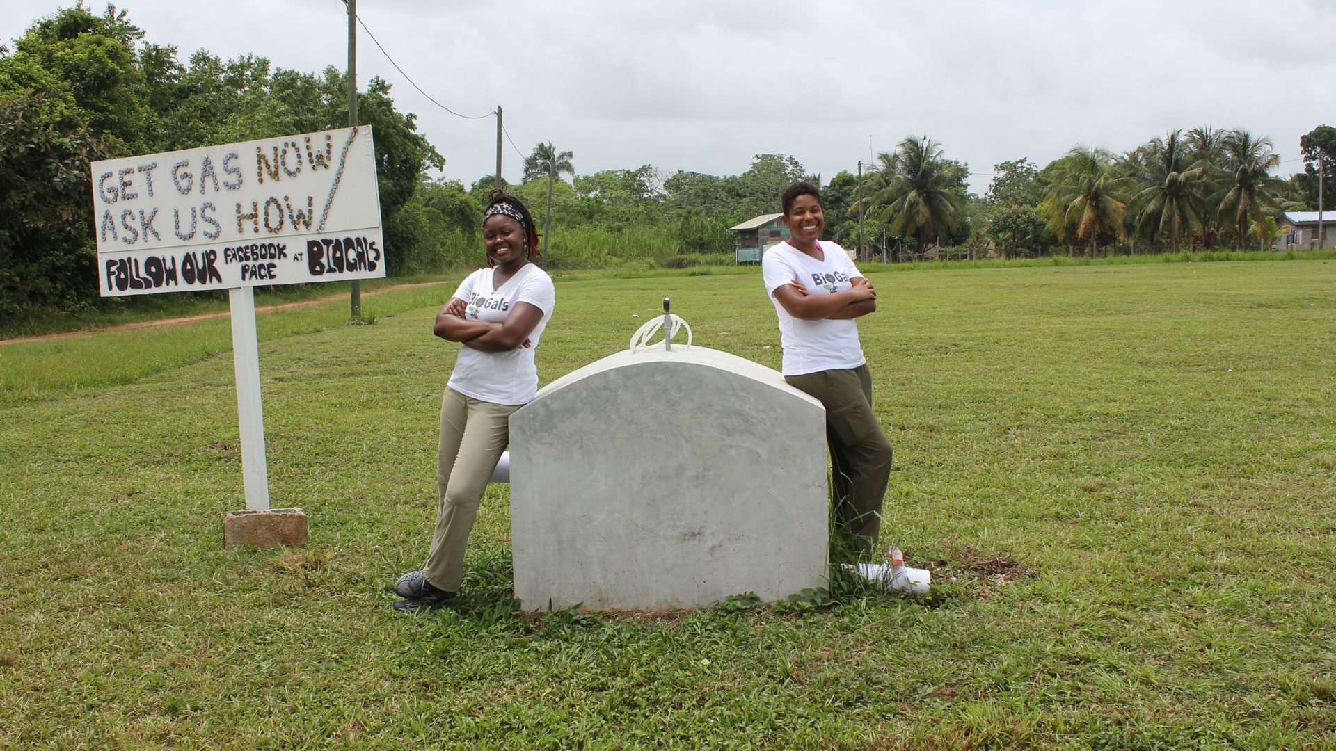 Shakira Hobbs (left) and Evvan Morton (right) with their anaerobic digester prototype in Sittee River, Belize