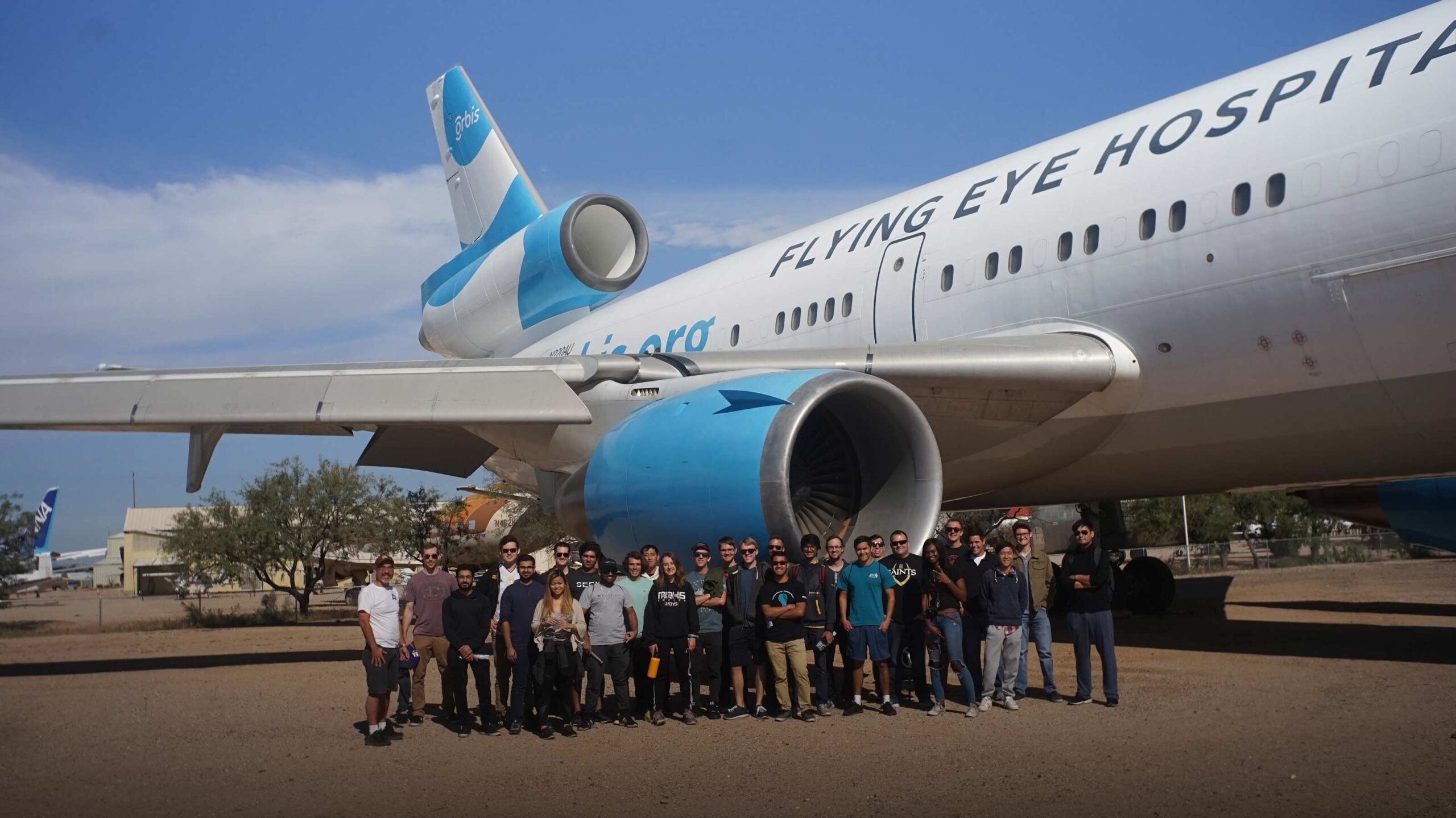 DSC06194w photo of Air Devils student group next to an airplane on a field trip to the Pima Air & Space Museum in 2018