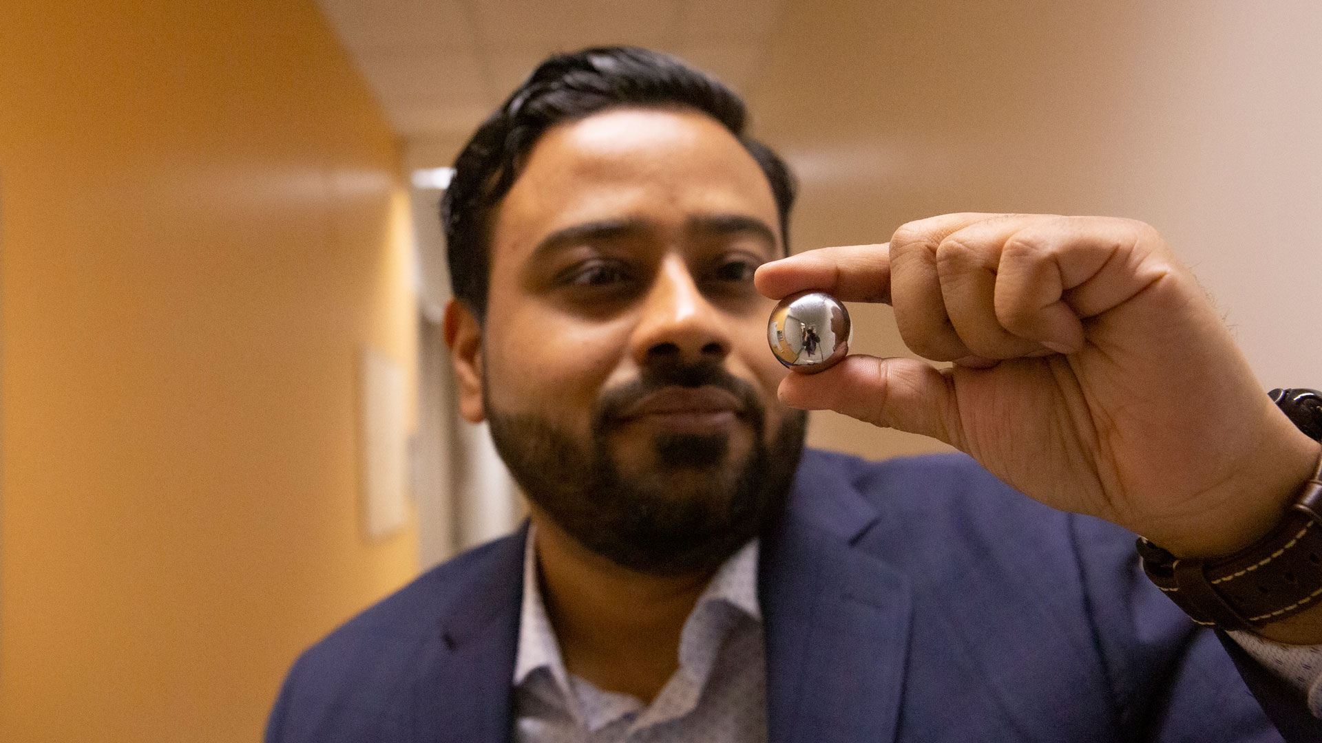 Kumar Ankit holds a steel ball bearing.