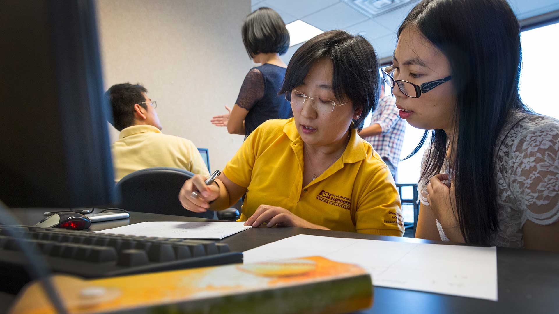 Teresa Wu working with a student