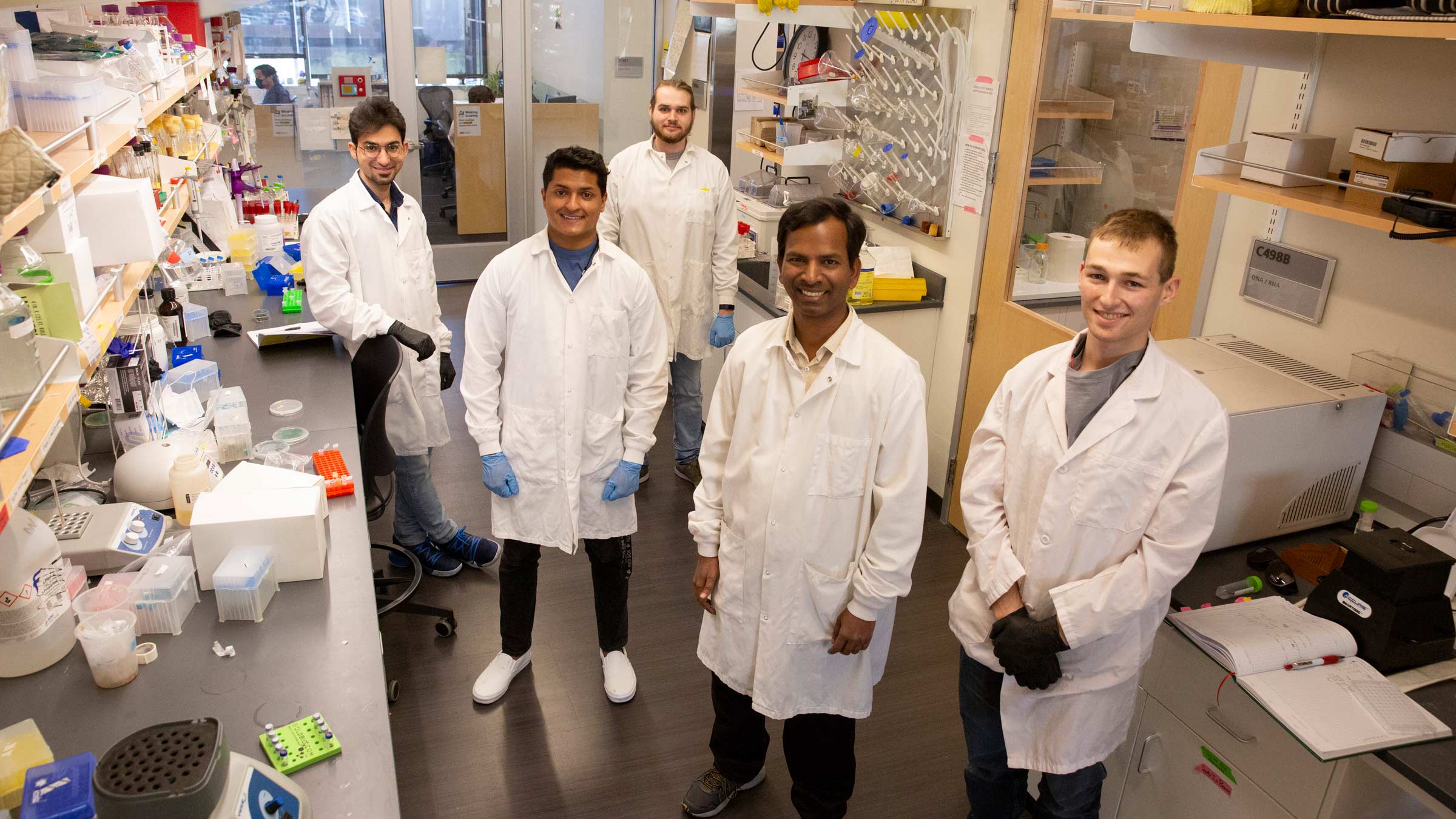 Arul Mozhy Varman and students in lab