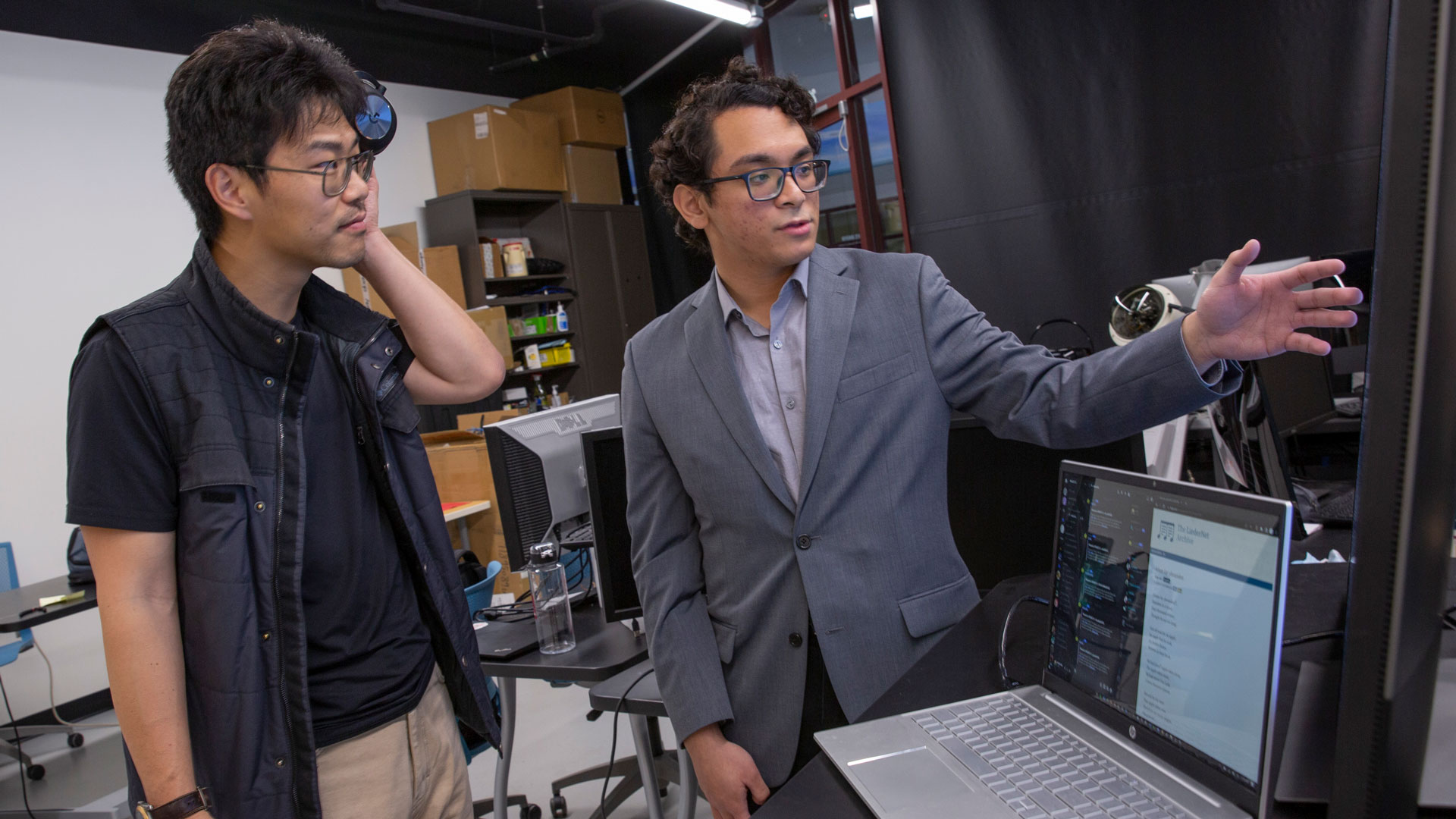 Ira A. Fulton Schools of Engineering Assistant Professor Yezhou Yang and computer science major Benjamin Joseph L. Herrera.