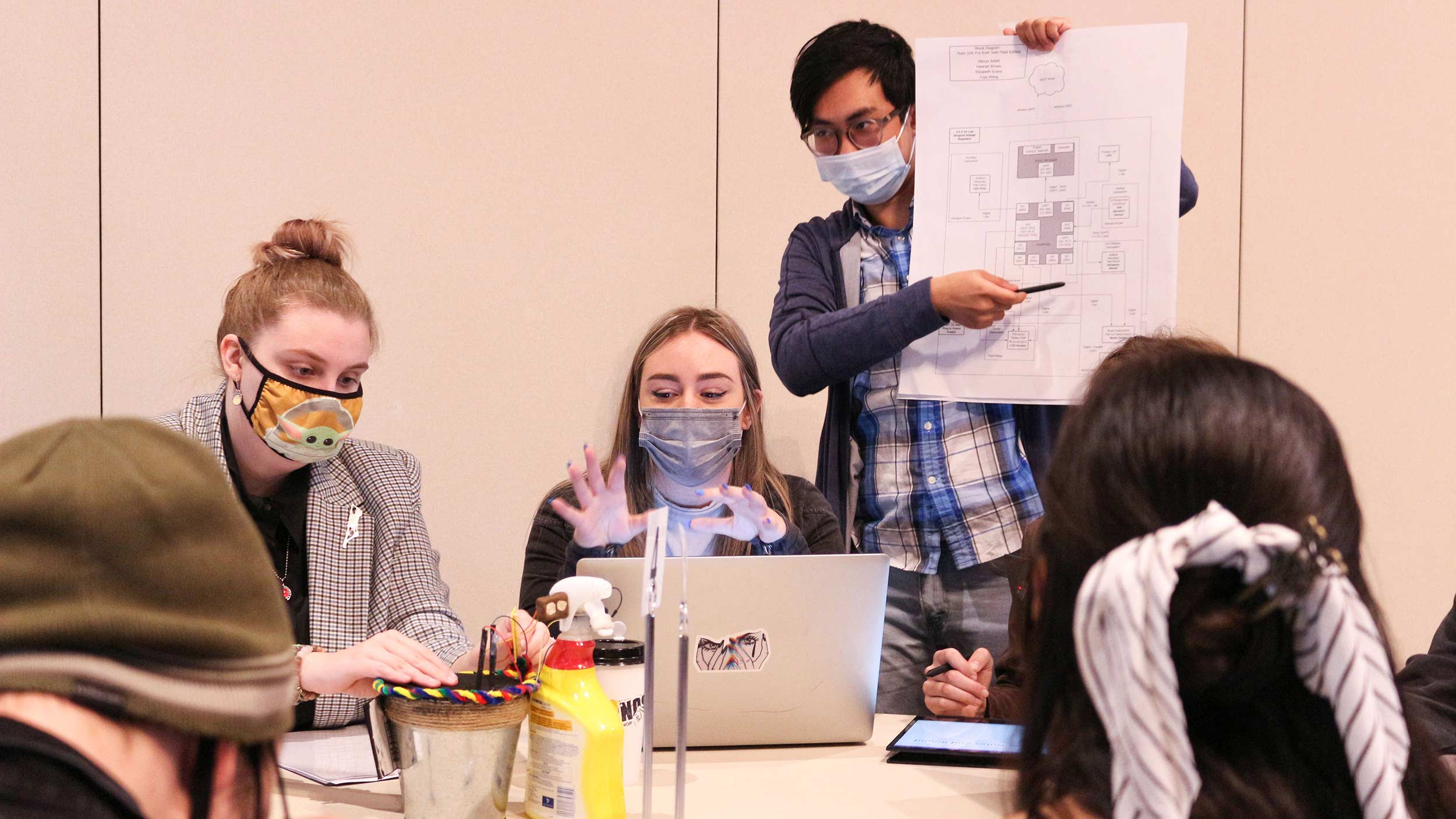 students working around a table