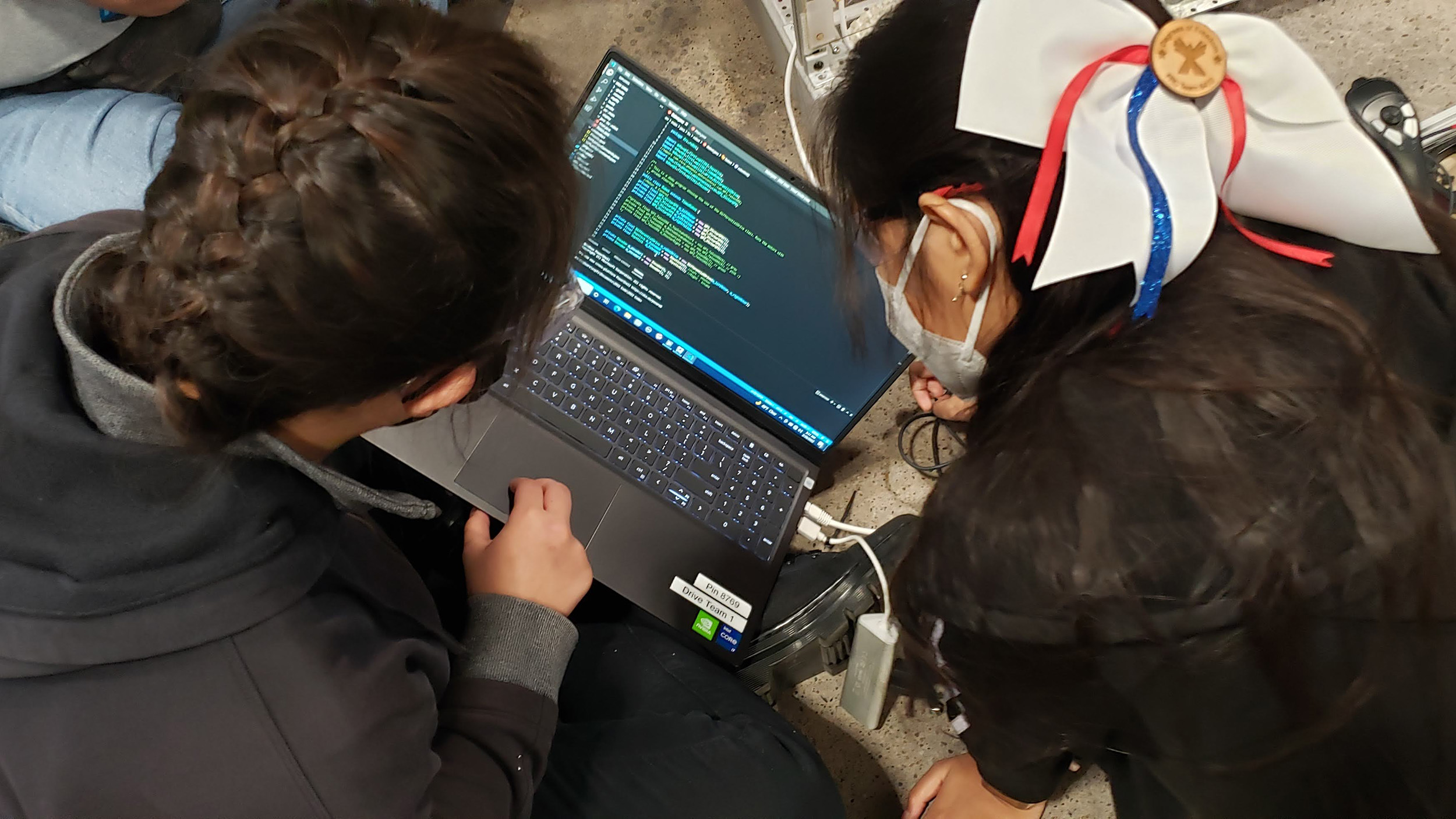 students looking at a laptop