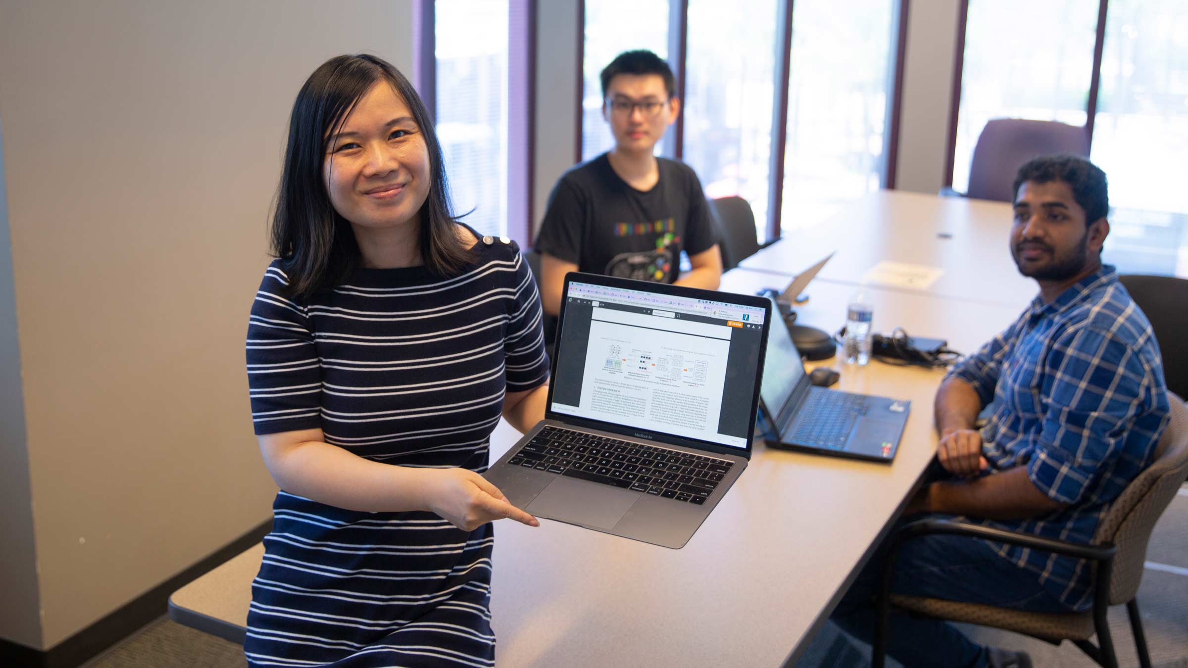 CAREER Award winner Jia Zou with two of her students