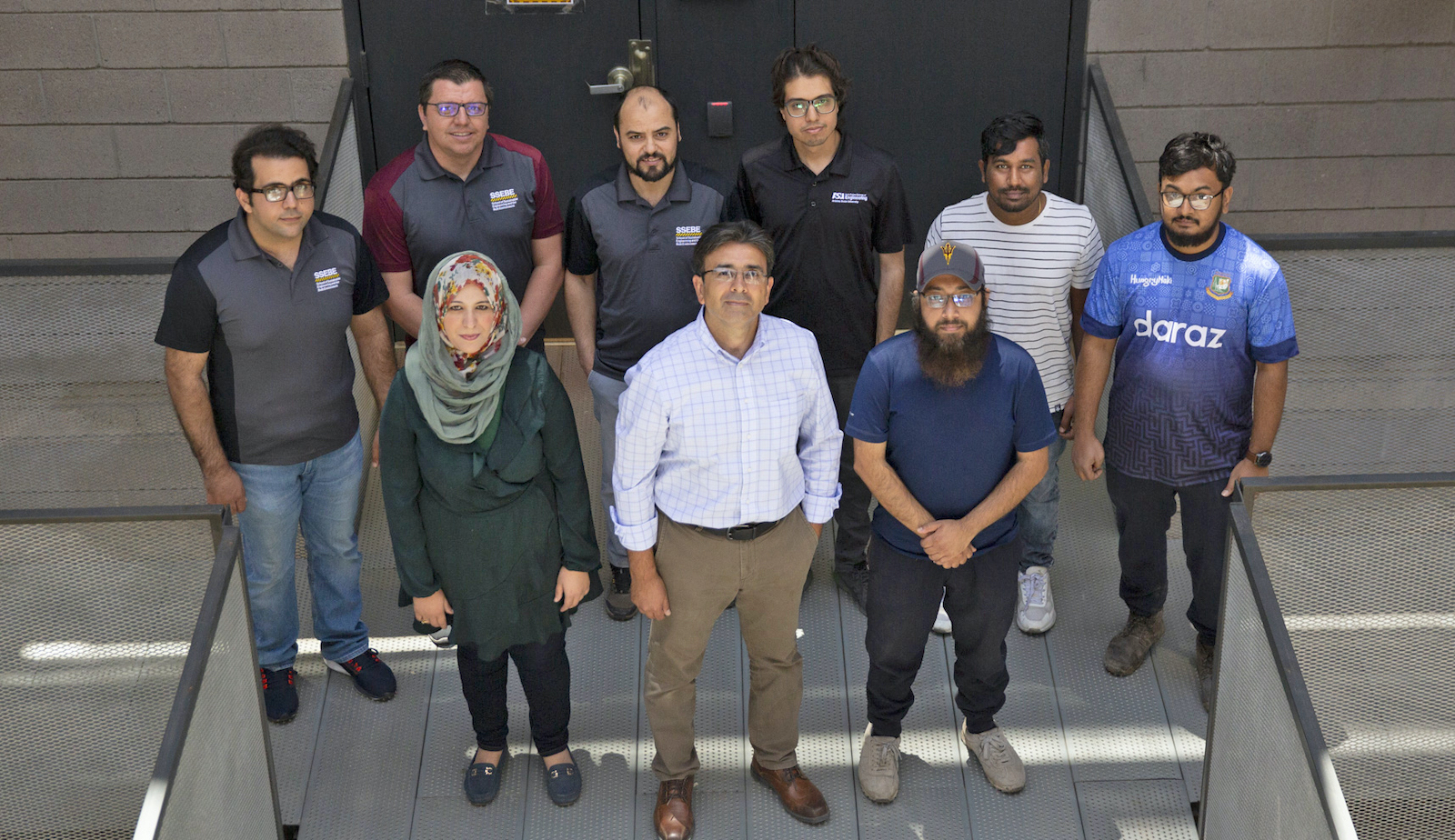 ASU Professor Hasan Ozer is seen with his pavement research students