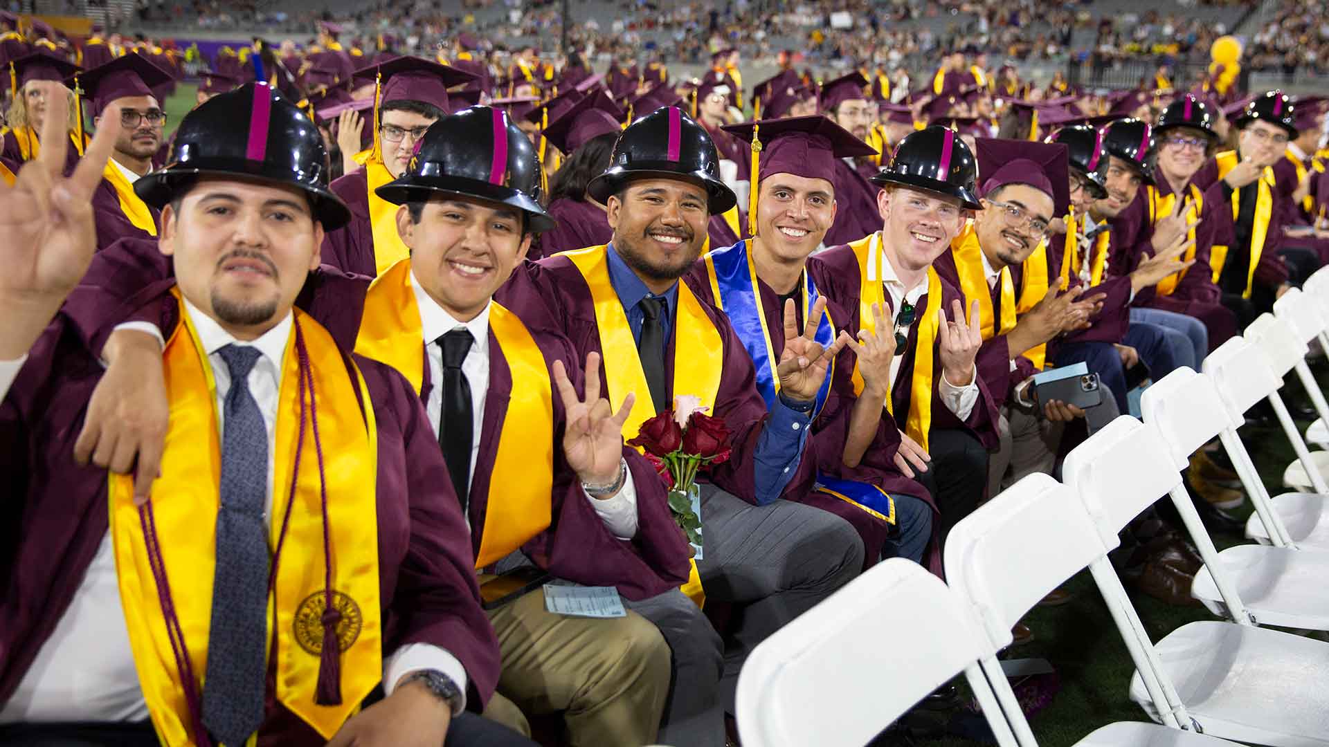 graduates of the Del E. Webb School of Construction in hard hats at convocation