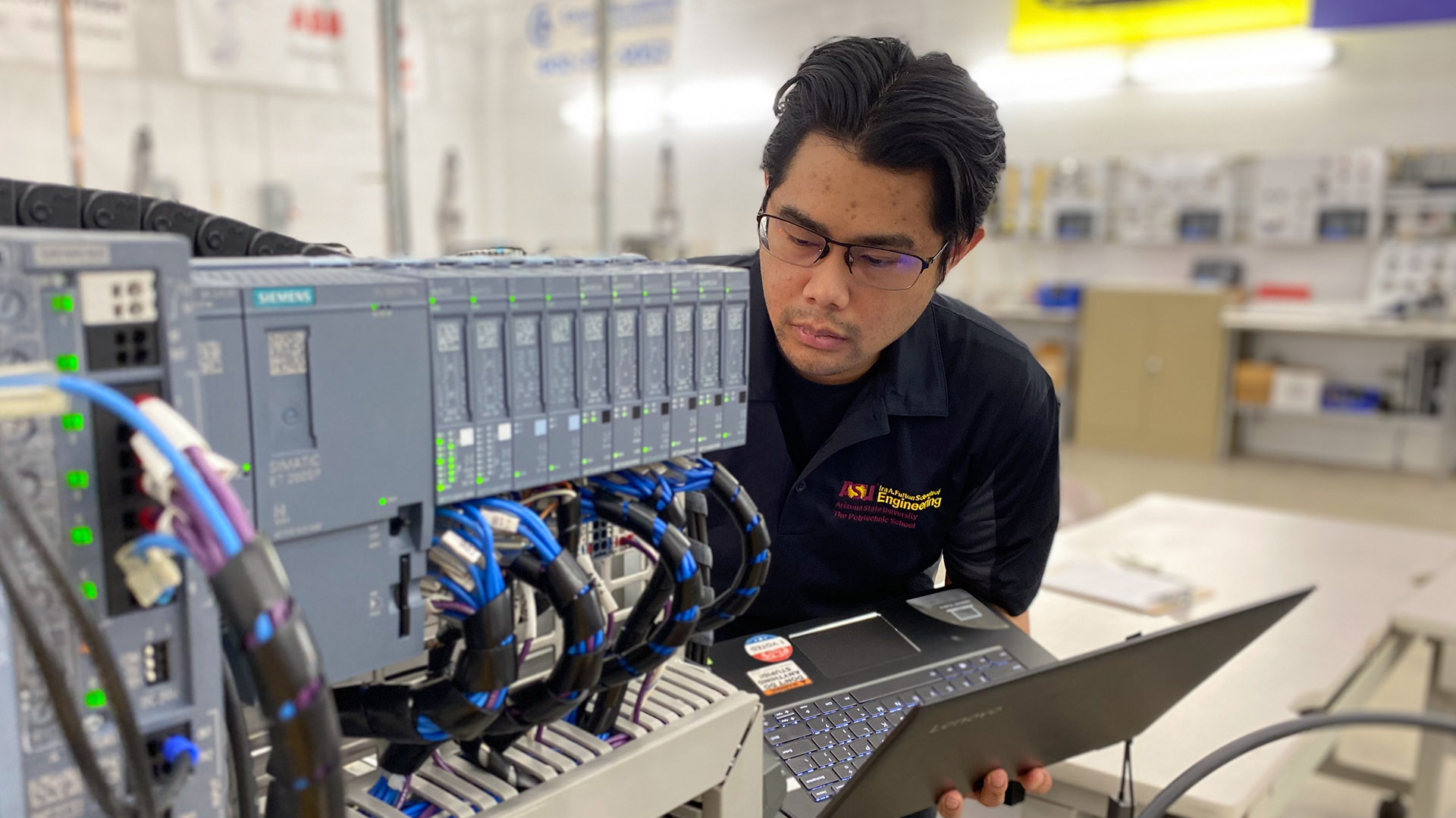 Jean-Francois Enriquez working with electronic equipment