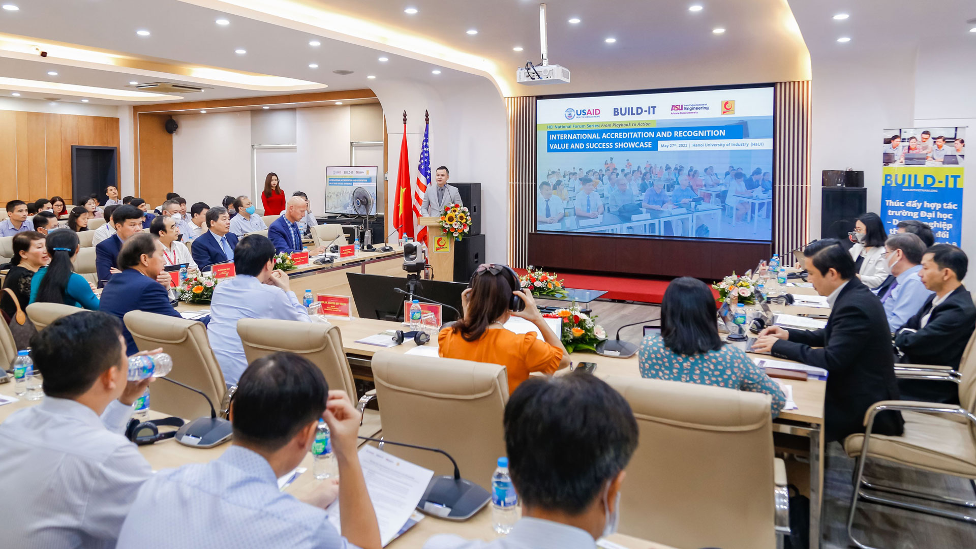 Representatives from BUILD-IT discuss accreditation success stories in a forum at Hanoi University of Industry.