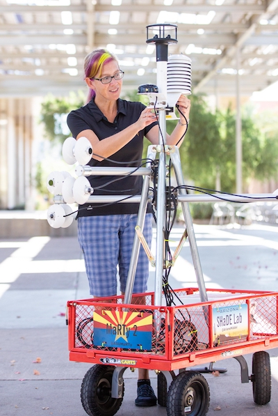 Ariane Middel adjusts instruments on MaRTy, a mobile biometeorological sensing station.