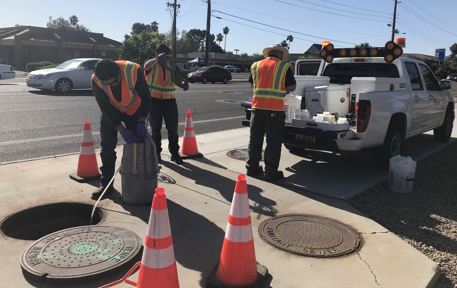 workers collecting wastewater samples in Tempe