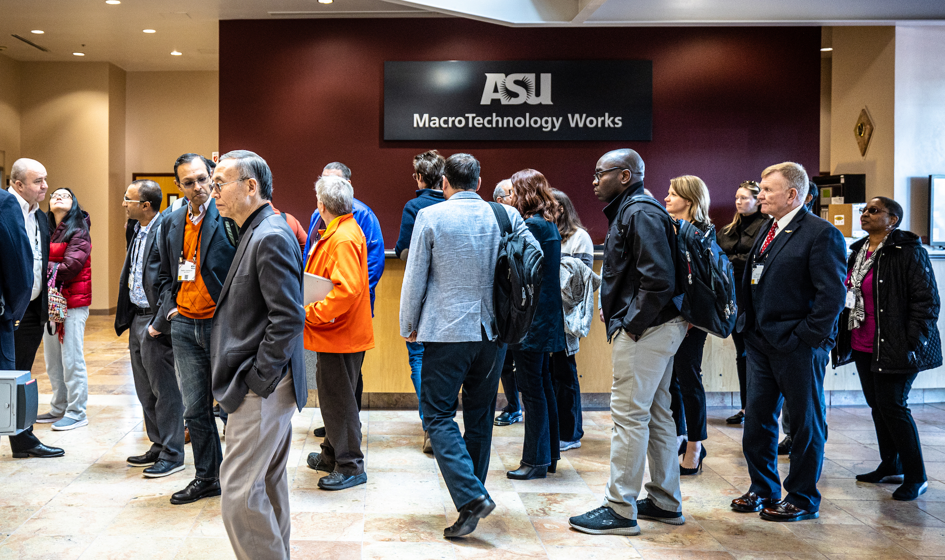 A group tours the MacroTechnology Works facility at ASU