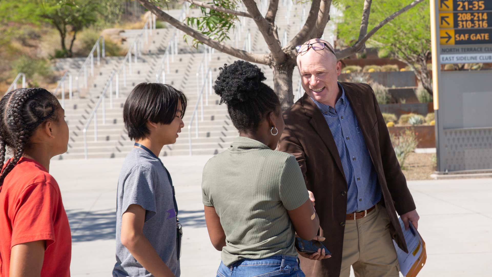 Greg Haggerty greeting students at Sun Devil Stadium