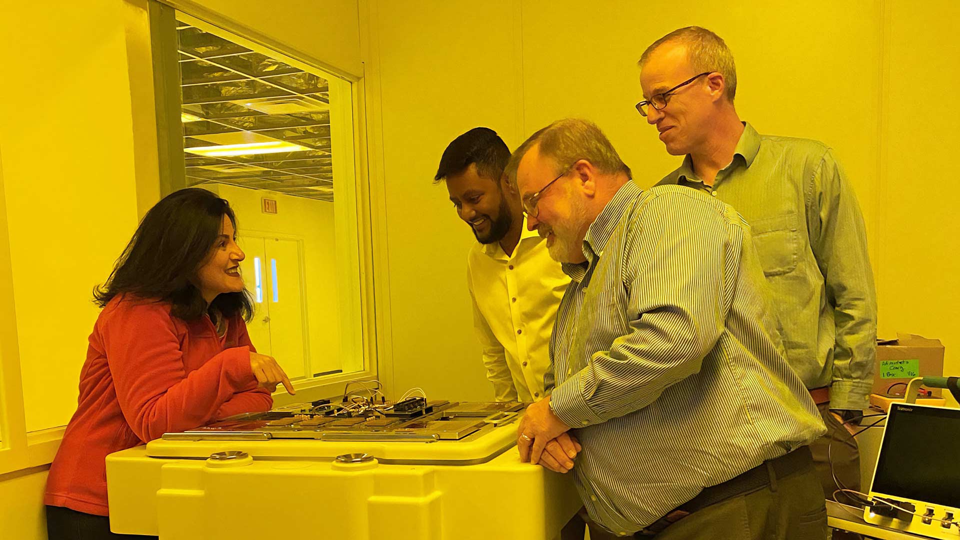 four people in a lab