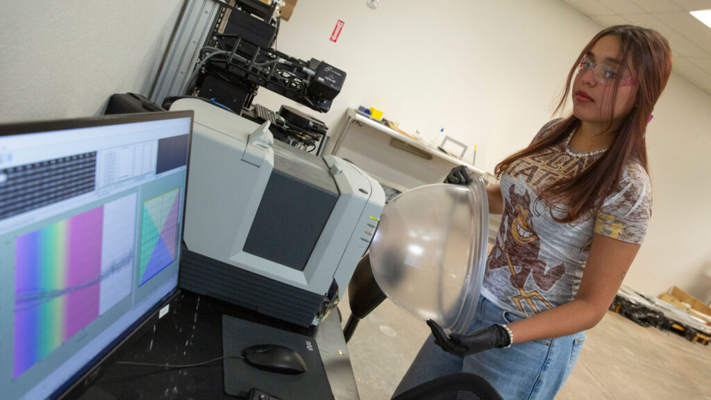 Abril Ramos works with lab equipment at Swift Coat.